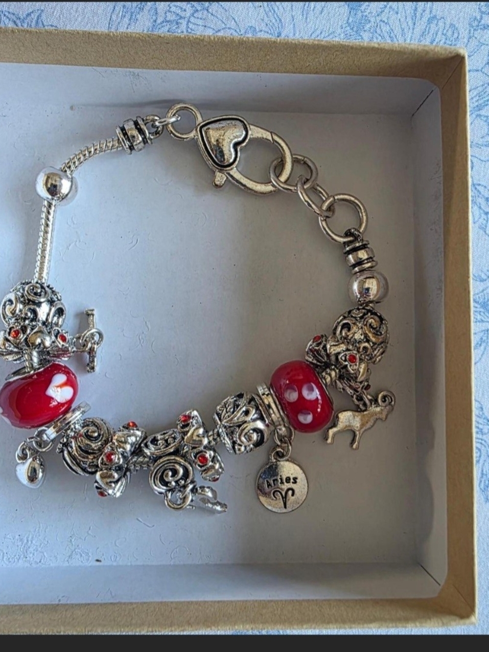 Silver Charm Bracelet with Red Beads and Aries Pendant